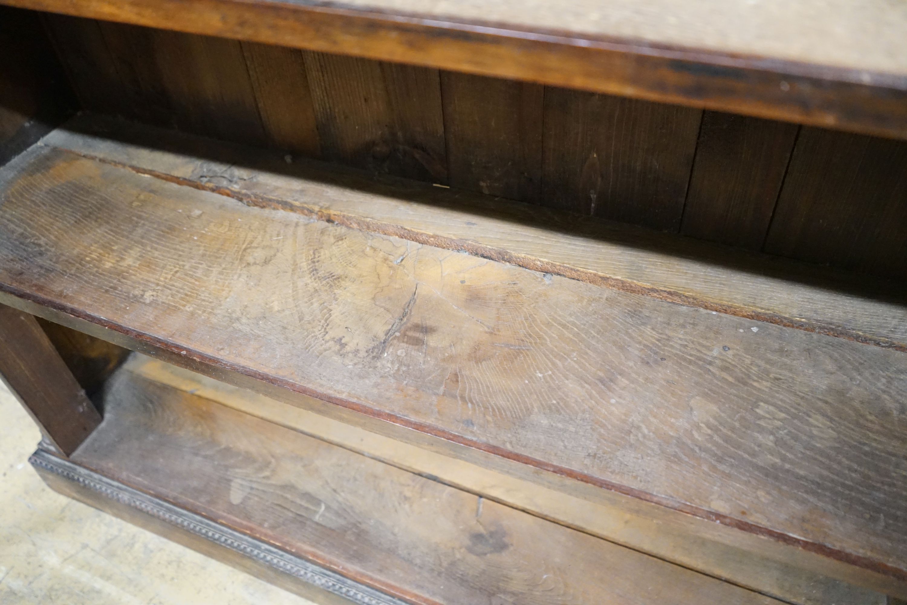 A Victorian mahogany open bookcase on carved plinth foot, width 114cm, depth 31cm, height 111cm